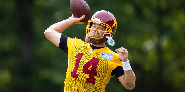 ASHBURN, VA - JUNE 02: Ryan Fitzpatrick #14 of the Washington Football Team throws during the organized team activity at Inova Sports Performance Center on June 2, 2021 in Ashburn, Virginia. (Photo by Scott Taetsch/Getty Images)