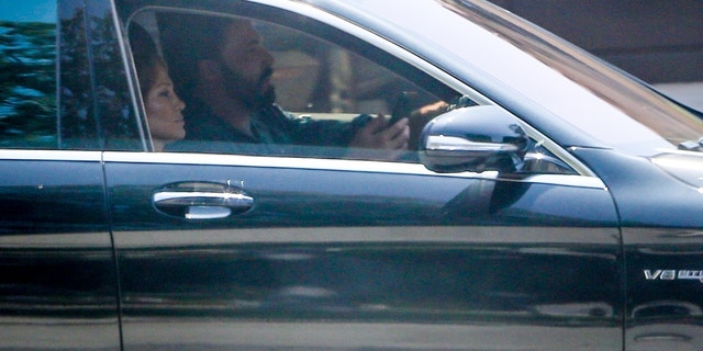 Ben Affleck and Jennifer Lopez took their children Emme and Max to visit a house in Santa Monica on Friday.  Lopez looked busy on the phone as Ben drove the car while he searched for a house.