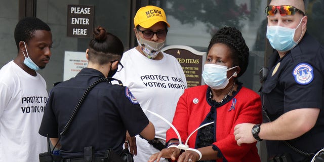 U.S. Rep. Sheila Jackson Lee, D-Texas, is arrested by a member of U.S. Capitol Police as she participates in a civil disobedience during a protest outside Hart Senate Office Building on Capitol Hill, July 29, 2021. (Getty Images)