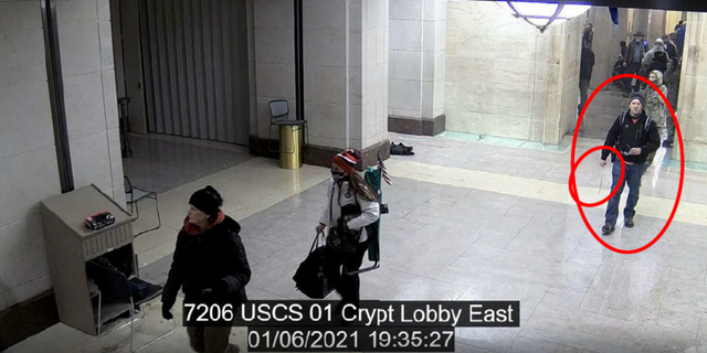 An FBI agent wrote in charging documents that Andrew Quentin Taake can be seen walking through the Capitol building with a whip-like weapon.