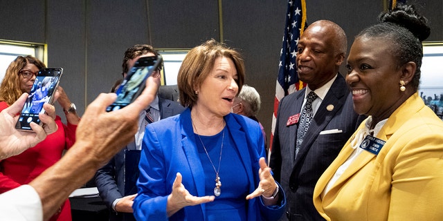 Senator Amy Klobuchar, center, D-Minn., Speaks with Georgia state lawmakers following a field hearing of the Senate Rules Committee on Voting Rights at the National Center for rights in Atlanta, Monday, July 19, 2021 (AP Photo / Ben Gray)