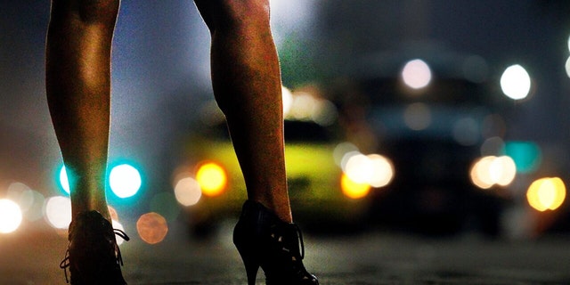 This open-air sex market has operated in plain sight on Friday and Saturday nights for months. The women, many likely trafficking victims, stop drivers who line up for their services. Their pimps pull the strings from the shadows.