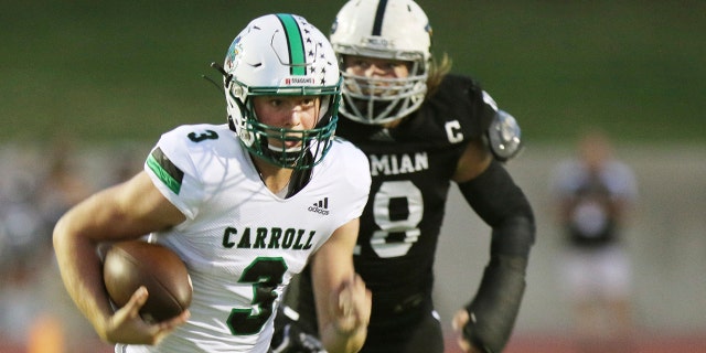 Under Pressure, Southlake Carroll's quarterback, Sophomore Quinn Ewers (3) runs the ball for a first down in the first quarter in their game against the Permian Panthers Friday night in Odessa Texas on September 13, 2019.