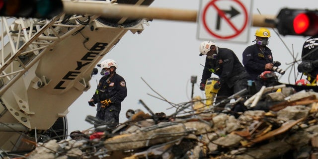 Search and rescue personnel are working on the rubble of the Champlain Towers South condo building on Wednesday. (PA)