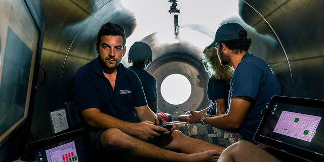 This undated photo provided by OceanGate Expeditions in June 2021 shows the interior of company's Titan submersible. The undersea exploration company plans to dive to the sunken Titanic as early as Wednesday, June 30, 2021, to begin what’s expected to be an annual chronicling of the shipwreck’s ongoing deterioration. (OceanGate Expeditions via AP)