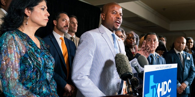 Democratic Texas State Rep. Ron Reynolds from Missouri City, center, together with fellow Texas legislators, speaks during a news conference, Wednesday, July 14, 2021, in Washington.