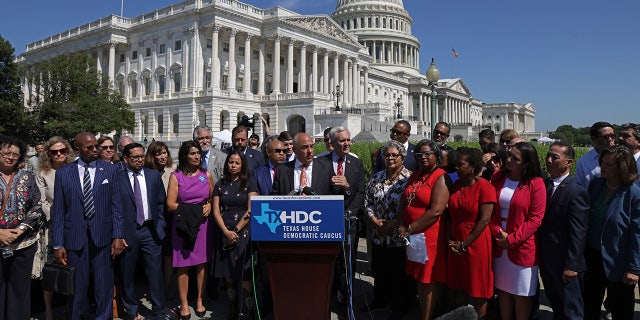 WASHINGTON, DC - JULY 13: Flanked by other state House Democrats, Texas State Rep. Chris Turner (D-District 101) (C), Chair of the Texas House Democratic Caucus, speaks during a news conference on voting rights outside the U.S. Capitol July 13, 2021 in Washington, D.C. (Photo by Alex Wong/Getty Images)