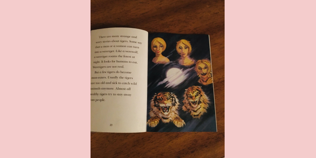 A book showing a killer tiger formed from a White woman.