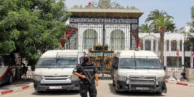 Police cars and a military armored vehicle blocked the entrance to the Tunisian parliament in Tunis on Tuesday.