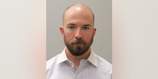 This booking photograph from Friday, May 7, 2021, shows Huntsville, Ala., police officer William Darby, who was convicted of murder in a fatal shooting that happened in 2018.   Darby resigned on Friday, July 23, after being paid by the city for more than two months after his murder conviction.