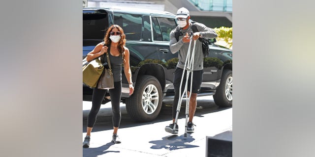Woods appeared to be putting more weight on his injured right leg.