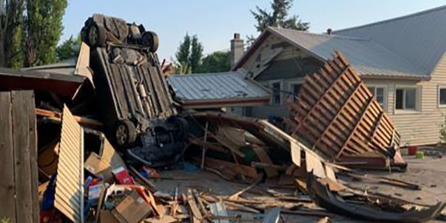 A car appeared to have been flipped into the Chelewah home.