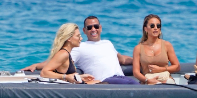 A-Rod celebrated his 46th birthday with a mystery blonde woman, country singer Jessie James Decker (R), and her husband NFL star Eric Decker (not shown). 