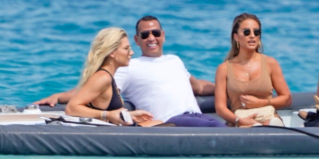 A-Rod celebrated his 46th birthday with a mystery blonde woman, country singer Jessie James Decker (R), and her husband NFL star Eric Decker (not shown).