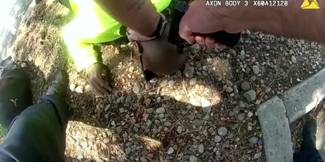 Body camera footage appeared to show Officer John Haubert putting his gun to the back of Kyle Vinson's head. 