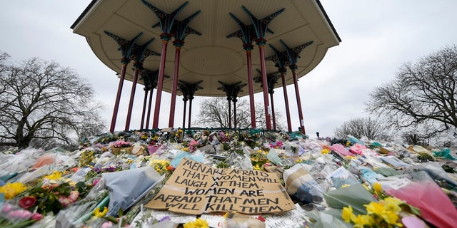 Floral tributes and messages are placed at the bandstand on Clapham Common in London in memory of Sarah Everard in March. (AP)
