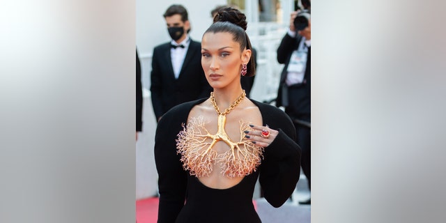 Bella Hadid at Cannes Film Festival in a necklace inspired by the human lungs by designer Daniel Roseberry for Schiaparelli’s Fall 2021 collection.