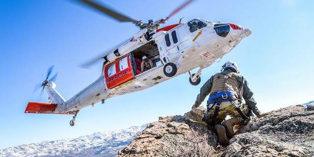 FILE PHOTO - FALLON, Nev. (April 8, 2021) An MH-60S Knighthawk helicopter assigned to the "Longhorns" of Helicopter Search and Rescue (SAR) Squadron, practices pinnacle landings and extractions during a mountain flying SAR training event. (U.S. Navy photo by Chief Mass Communication Specialist Shannon Renfroe)