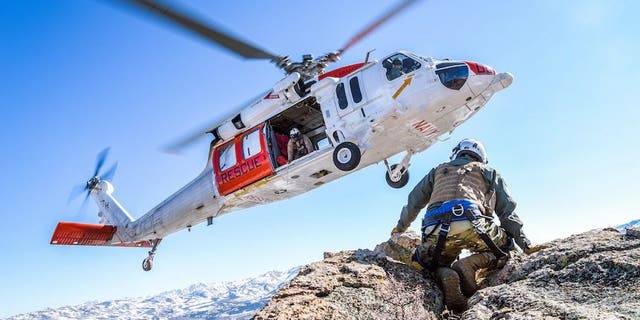 FILE PHOTO - FALLON, Nev. (April 8, 2021) An MH-60S Knighthawk helicopter assigned to the "Longhorns" of Helicopter Search and Rescue (SAR) Squadron, practices pinnacle landings and extractions during a mountain flying SAR training event. (U.S. Navy photo by Chief Mass Communication Specialist Shannon Renfroe)