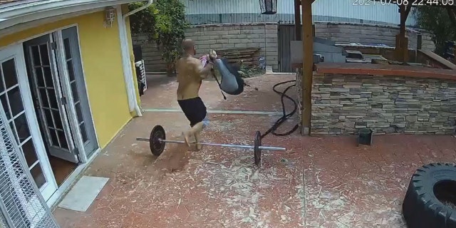 In this image taken from home surveillance video, the man appears to leave the house with a backpack.