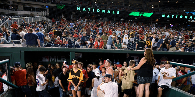 Fans are seen at Nationals Park after Saturday's game was delayed after the sound of gunfire.  (Associated press)