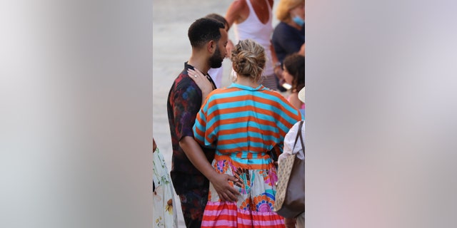 John Legend sweetly gives wife Chrissy Teigen a butt squeeze as the couple step out during their Italian getaway on July 6. 