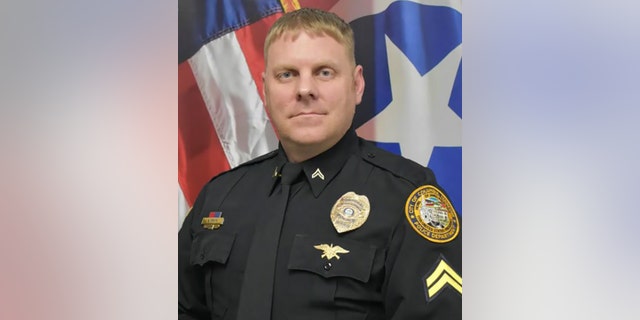 Corporal Allan Ervin wasted no time before running into the burning to rescue a disabled woman stuck inside.