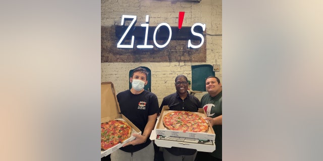 Andrew Wyatt, center, stands alongside Zio's staffers Giuseppe and Giovanni.