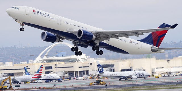 A Delta Air Lines Airbus takes off from Los Angeles International Airport. 
