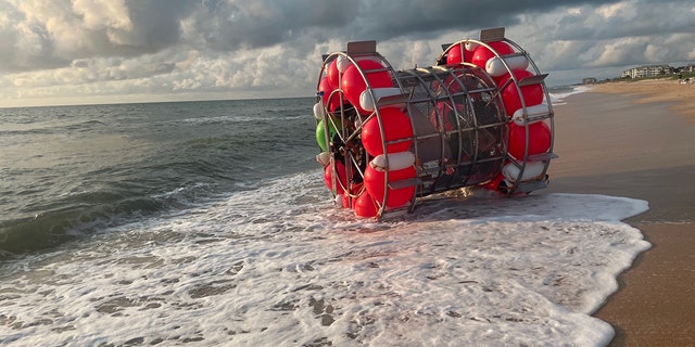 The sole occupant of the bubble-like vessel was found safe after washing ashore Saturday, authorities said.