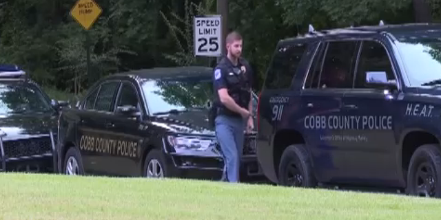Police are seen at Pinetree Country Club, in Atlanta’s Cobb County