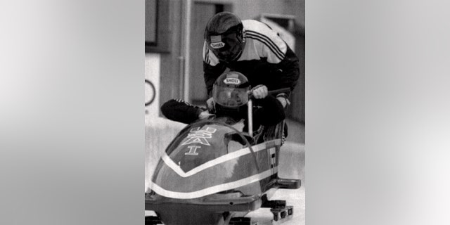 Herschel Walker (L) and Brian Shimer in the USA-1 sled during a practice session for the XVI Winter Olympics two man bobsled circa February 1992 in La Plagne, France. (Photo by Sporting News via Getty Images via Getty Images)