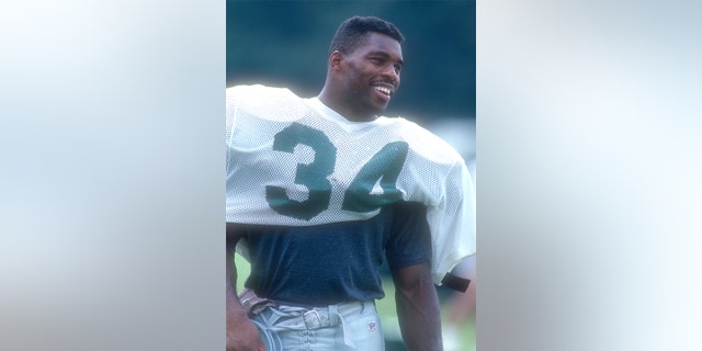 Herschel Walker #34 of the Philadelphia Eagles looks on during training camp at West Chester University on July 27, 1994 at West Chester University in West Chester, Pennsylvania. (Photo by Mitchell Layton/Getty Images)