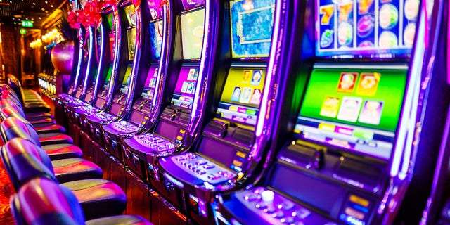 A row of slot machines inside a casino.