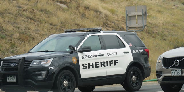 GOLDEN, COLORADO—OCTOBER 2017: A Jefferson County police car blends in with the traffic in Golden, Colorado.
