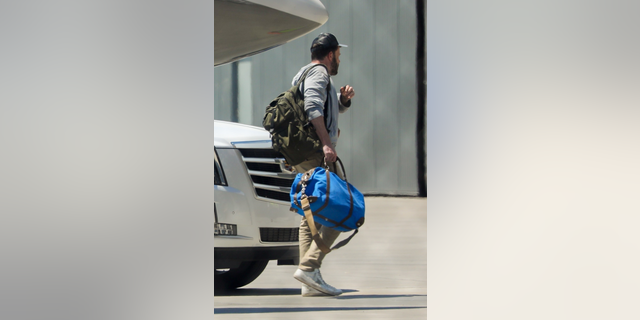Ben Affleck returns from the Hamptons with Jennifer Lopez.