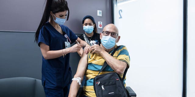 Yoel Mor, who recovered from cancer, receives his third dose of COVID-19 vaccine at Sheba Medical Center on July 14, 2021 in Ramat Gan, Israel.