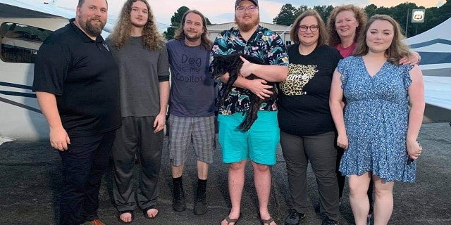 The Howard family reuniting with Razzle after 10 years. Pictured from left to right: Aaron Howard, Simon Howard, Jeremy Wade, Seth Howard, Rhonda Howard, Vickey Langley, Seth’s wife, Elizabeth.