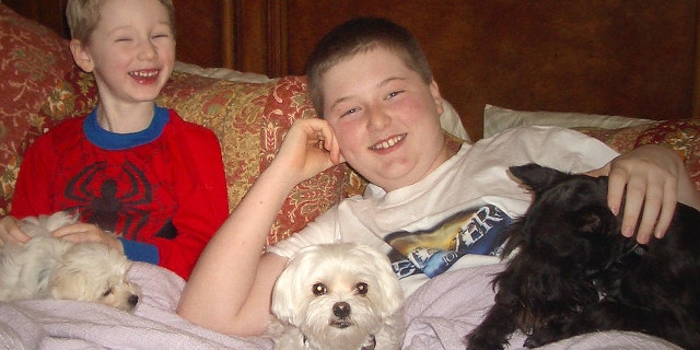 Simon, 5, and Seth, 12, and their dog Razzle.