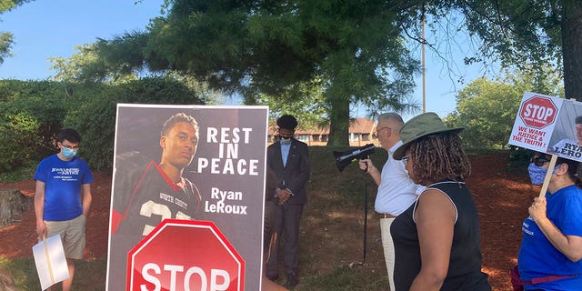 Activists gather for a vigil on Tuesday, July 27, 2021 near the McDonald’s restaurant in Gaithersburg, Md., where Ryan LeRoux, a 21-year-old Black man, was shot and killed by police on July 16.