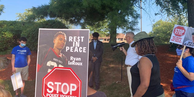 Activists gather for a vigil on Tuesday, July 27, 2021 near the McDonald’s restaurant in Gaithersburg, Md., where Ryan LeRoux, a 21-year-old Black man, was shot and killed by police on July 16.