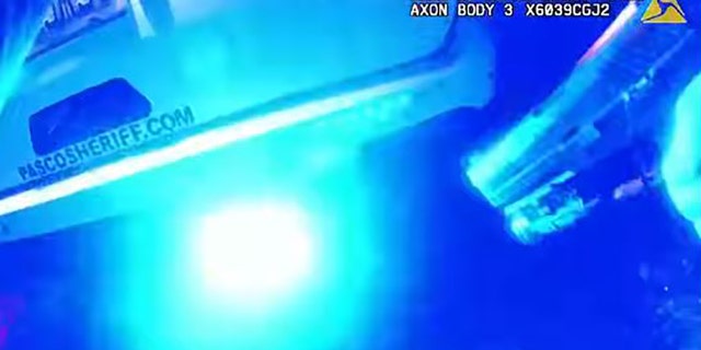 Bodycam video showed a deputy taking cover behind his patrol vehicle after a suspect opens fire on deputies.