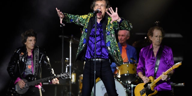 FILE - In this Aug. 22, 2019 file photo, Mick Jagger, center, performs with his Rolling Stones bandmates, from left, Ron Wood, Charlie Watts and Keith Richards during their concert at the Rose Bowl in Pasadena, Calif. (Photo by Chris Pizzello/Invision/AP, File)