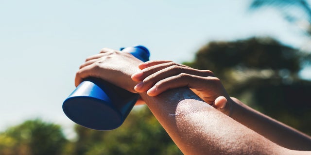 A person applies sunscreen. "I always suggest wearing sunscreen — an SPF broad-spectrum sunscreen — and then apply your makeup over it," said Dr. Frey. "And put it on liberally."