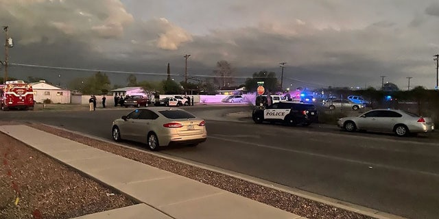This photo posted to Facebook by the Tucson Police Department shows the scene of a house fire and deadly shooting on Sunday. 