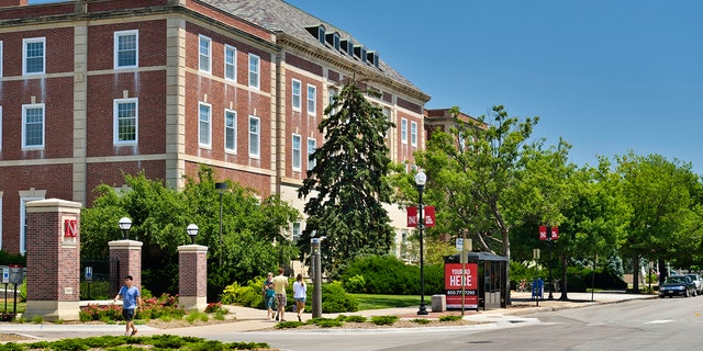Street side view of people at the campus of the University of Nebraska in downtown Lincoln, Nebraska.