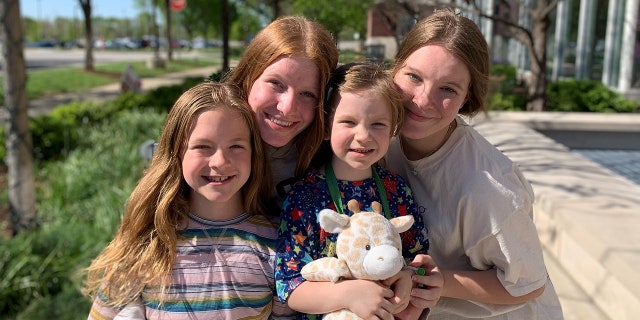 Vera pictured with her siblings above. 