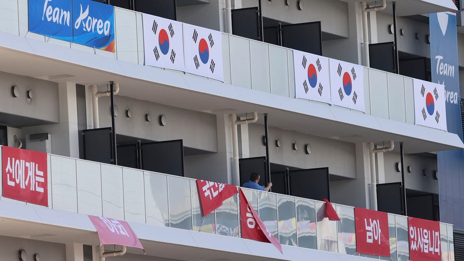 South Korea removes banners at Olympic village after IOC ruling