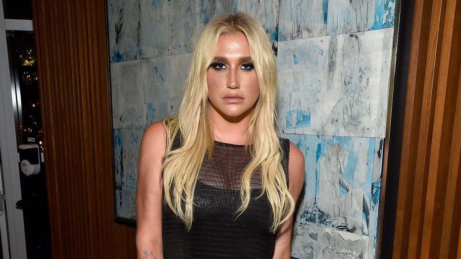 Kesha stuns in sheer black dress paired with thong bodysuit at movie premiere