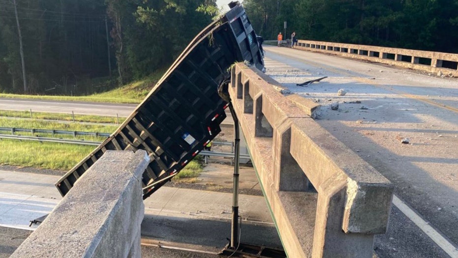 dump truck driver fails to lower bed hits overpass